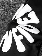 CAPTURE™— OVERSIZED TRACK PANTS
