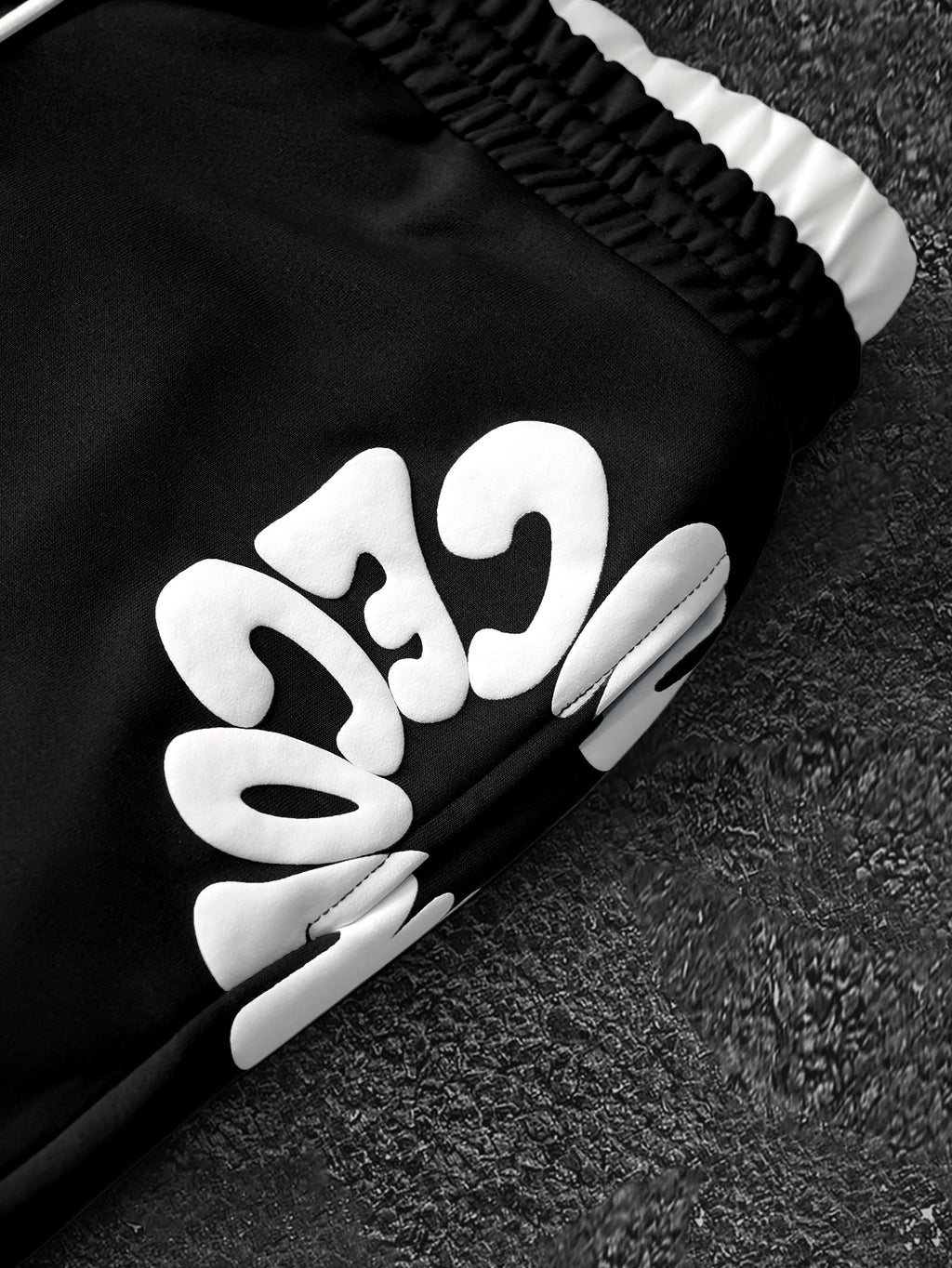 CAPTURE™— OVERSIZED TRACK PANTS
