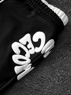 CAPTURE™— OVERSIZED TRACK PANTS