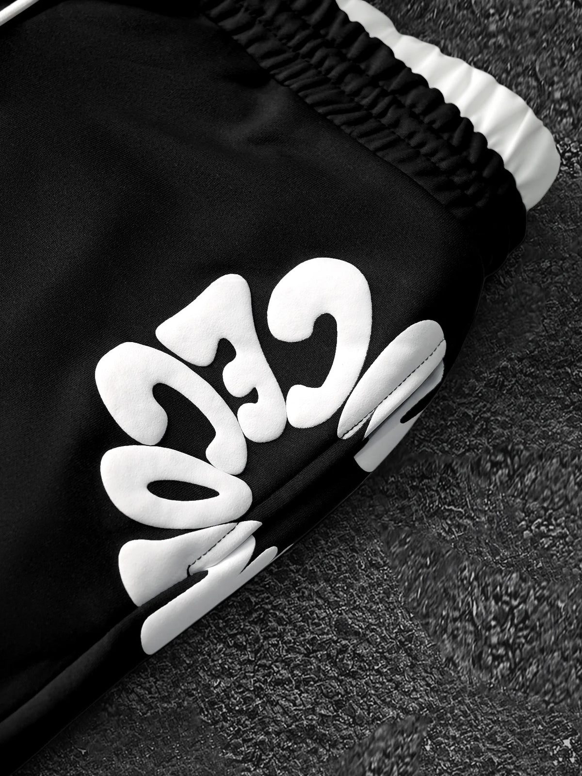 CAPTURE™— OVERSIZED TRACK PANTS