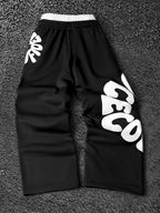 CAPTURE™— OVERSIZED TRACK PANTS