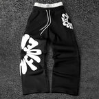 CAPTURE™— OVERSIZED TRACK PANTS