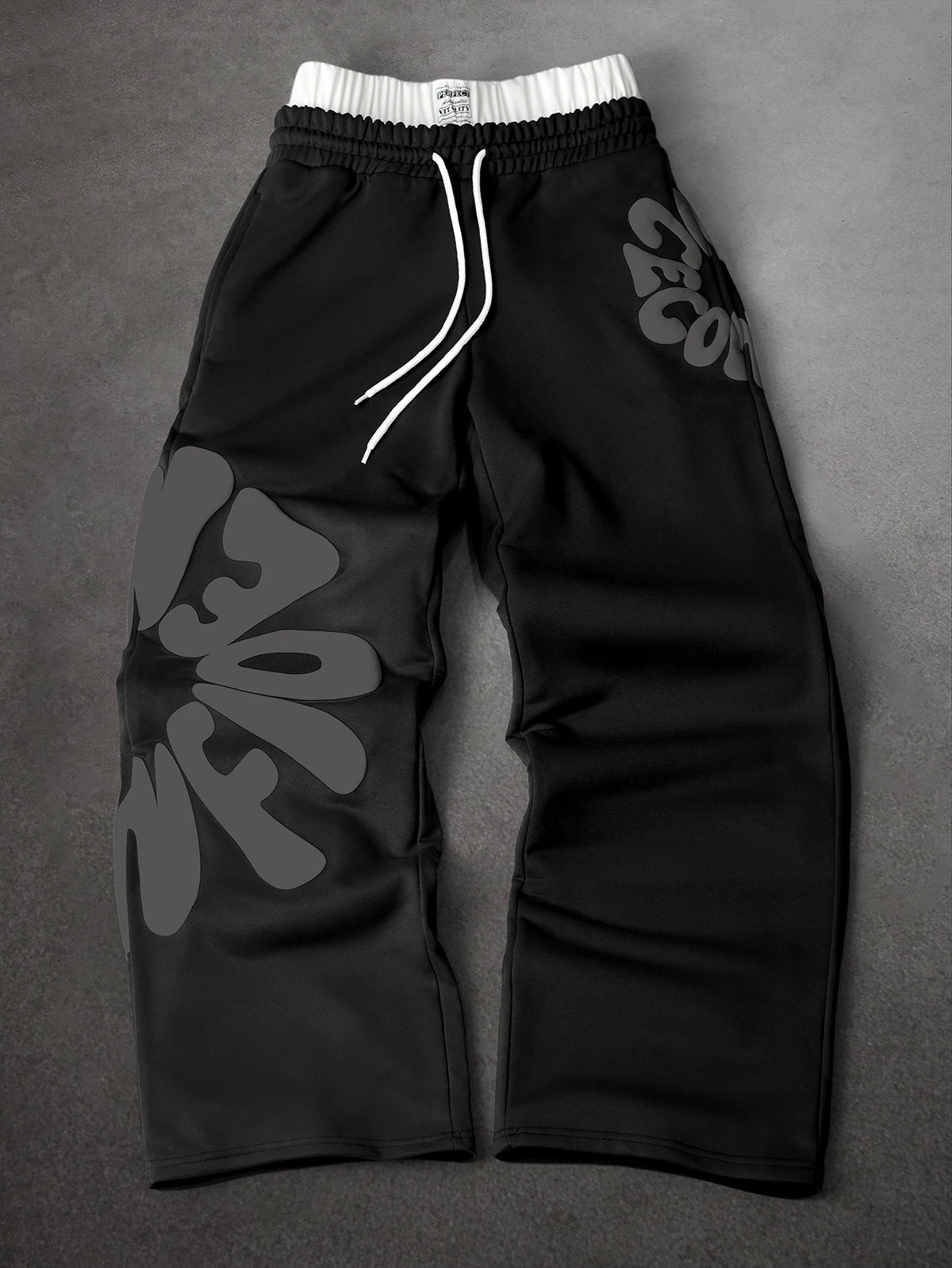 CAPTURE™— OVERSIZED TRACK PANTS