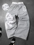 CAPTURE™— OVERSIZED TRACK PANTS