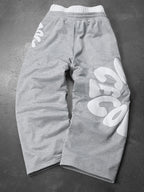CAPTURE™— OVERSIZED TRACK PANTS