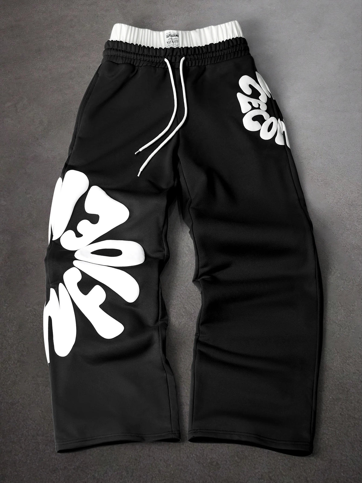 CAPTURE™— OVERSIZED TRACK PANTS