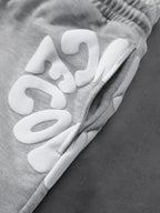 CAPTURE™— OVERSIZED TRACK PANTS