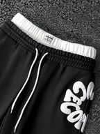 CAPTURE™— OVERSIZED TRACK PANTS