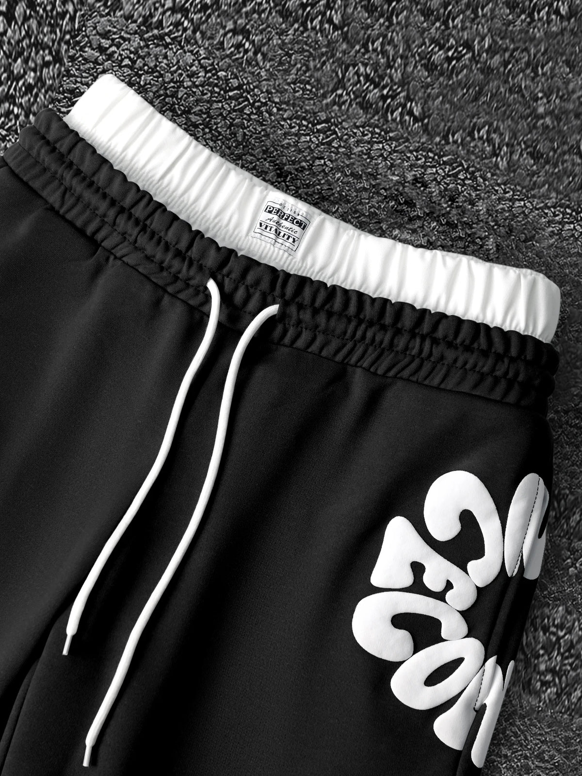 CAPTURE™— OVERSIZED TRACK PANTS